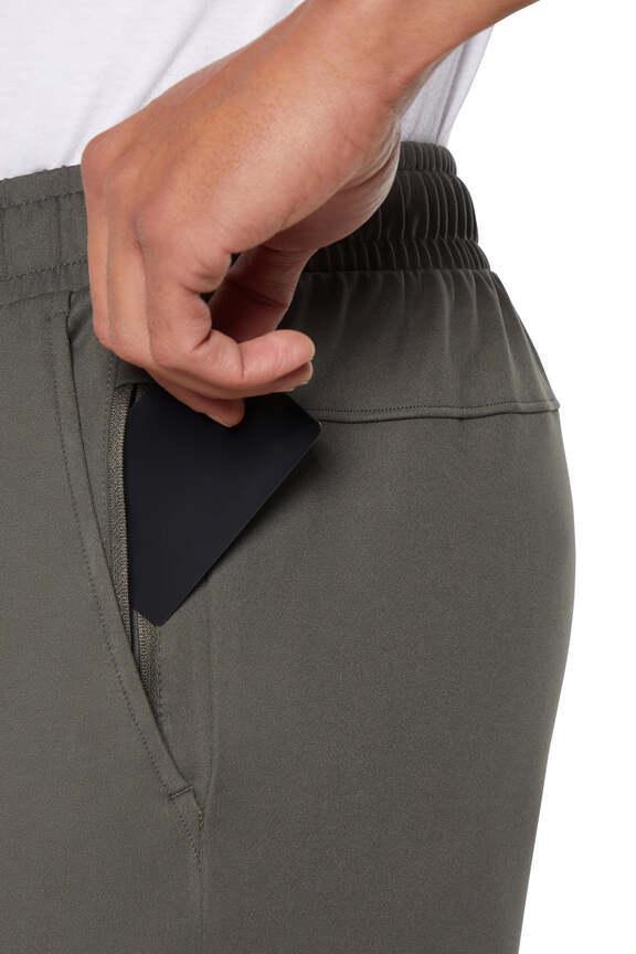 Balance Collection For Men Commission Pant, side view showing pocket placement, showing visible design features and texture of the durable stretch..