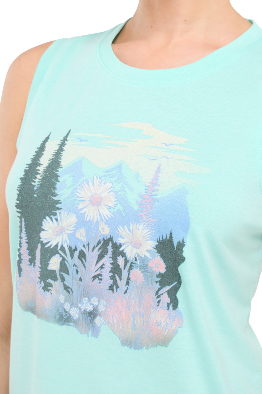 Close up view of woman wearing a light teal blue sleeveless shirt with a trees and flowers nature graphic design on a white background.