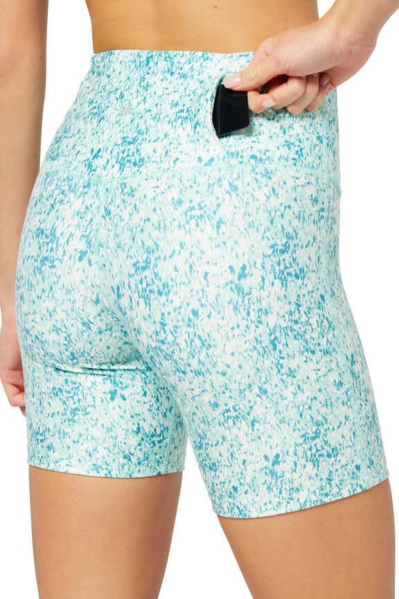 Fia Bermuda Short, side view showing pocket placement, showing visible design features and texture of the soft knit fabric..