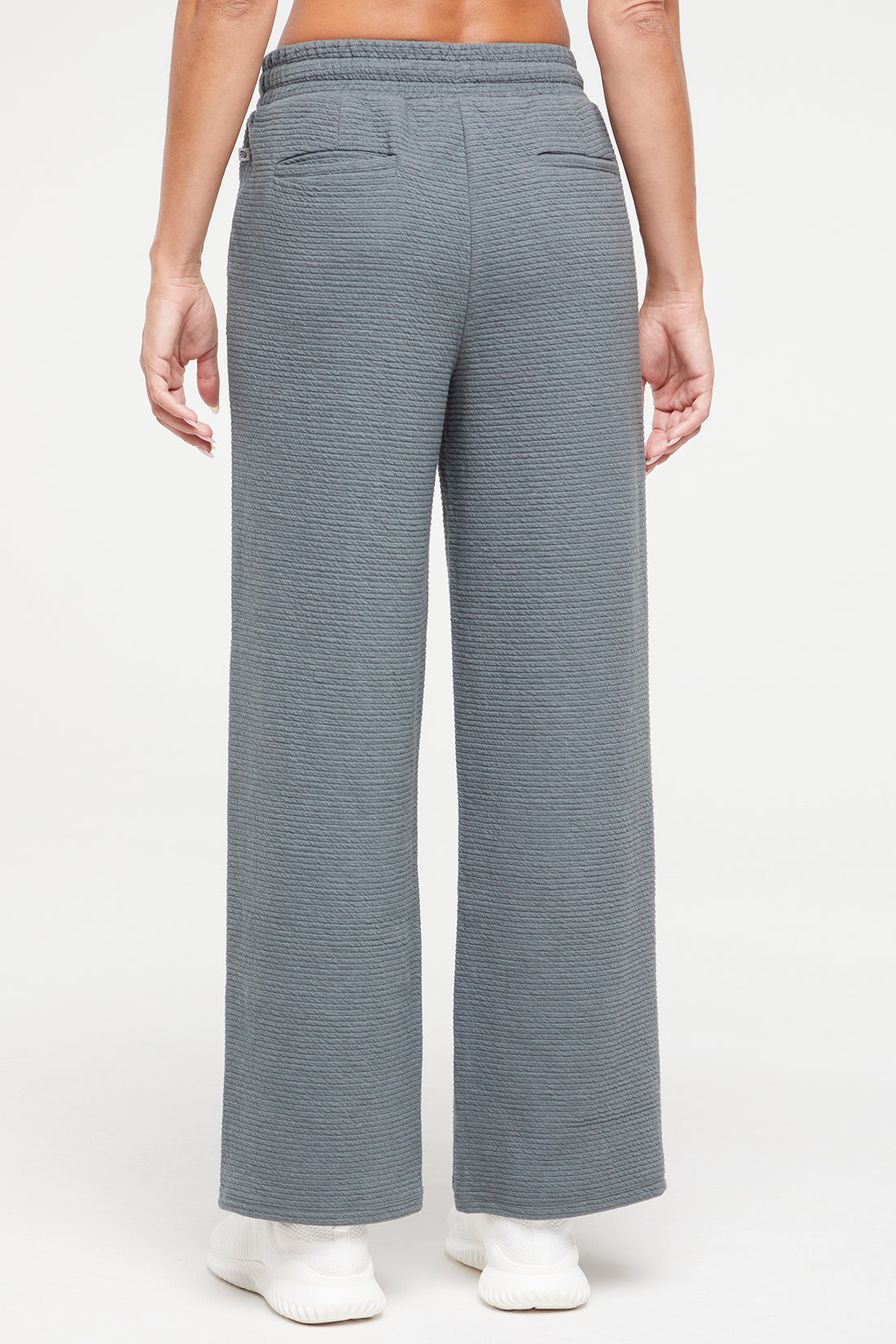 Freyi Pant, side view showing pocket placement, showing visible design features and texture of the durable stretch fabric..