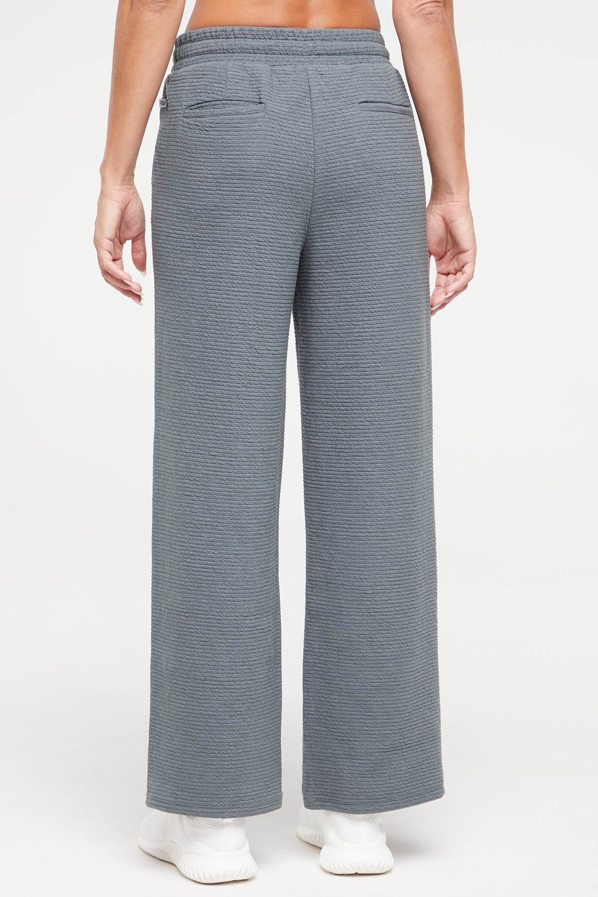 Freyi Pant, side view showing pocket placement, showing visible design features and texture of the durable stretch fabric..