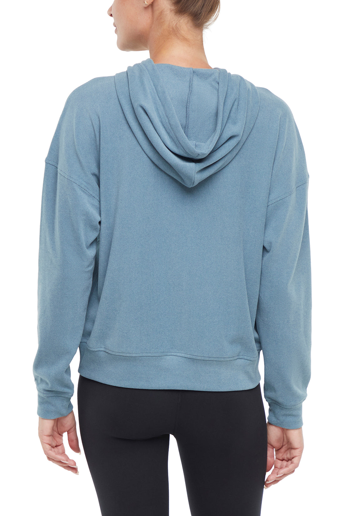 Riley Hoodie, side view showing pocket placement, showing visible design features and texture of the soft fleece fabric..