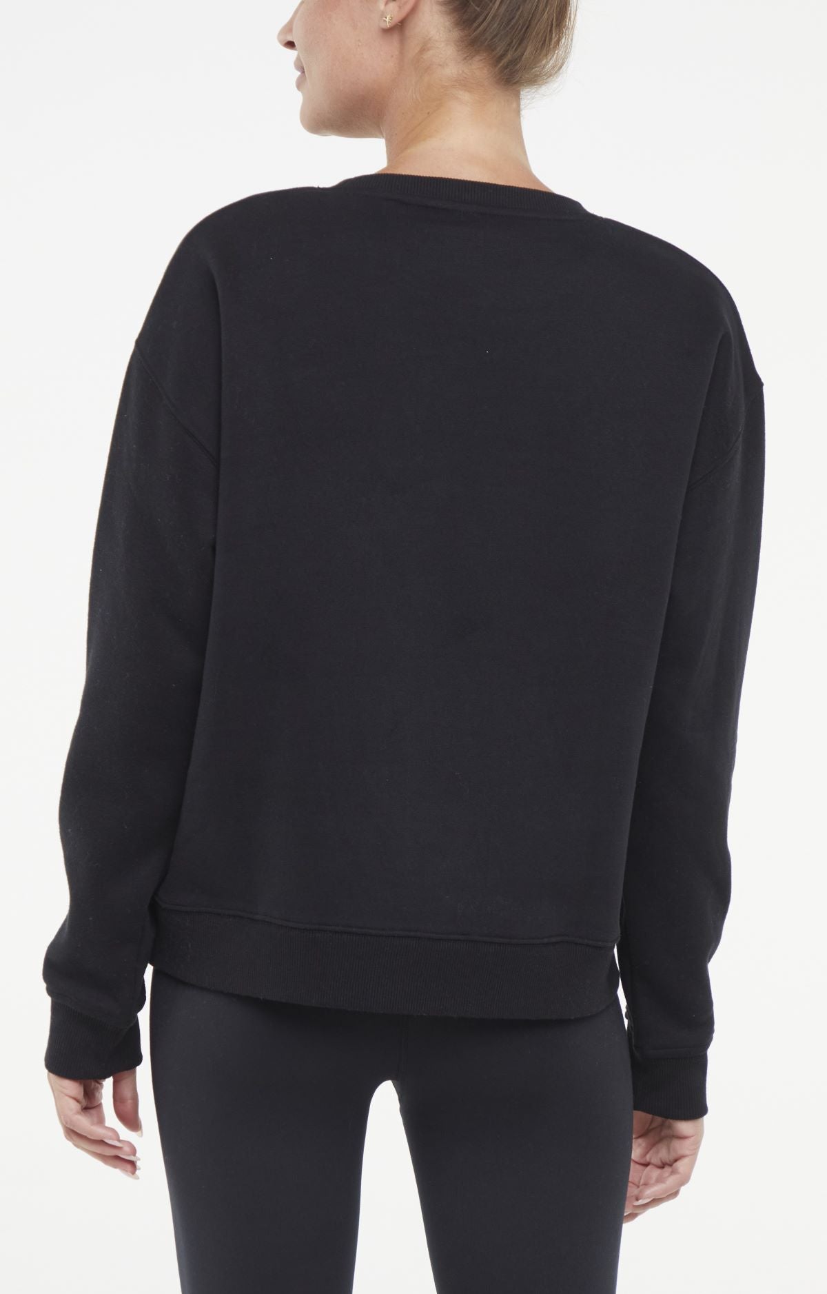 Camila Pullover, side view showing pocket placement, showing visible design features and texture of the soft knit fabric..