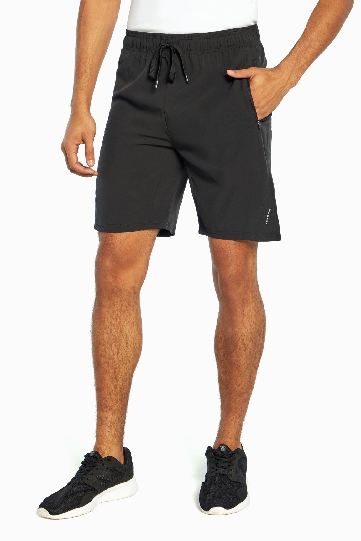 Balance Collection For Men Energy Black Short, front hand in pocket view, showing visible design features and texture of the soft knit fabric.