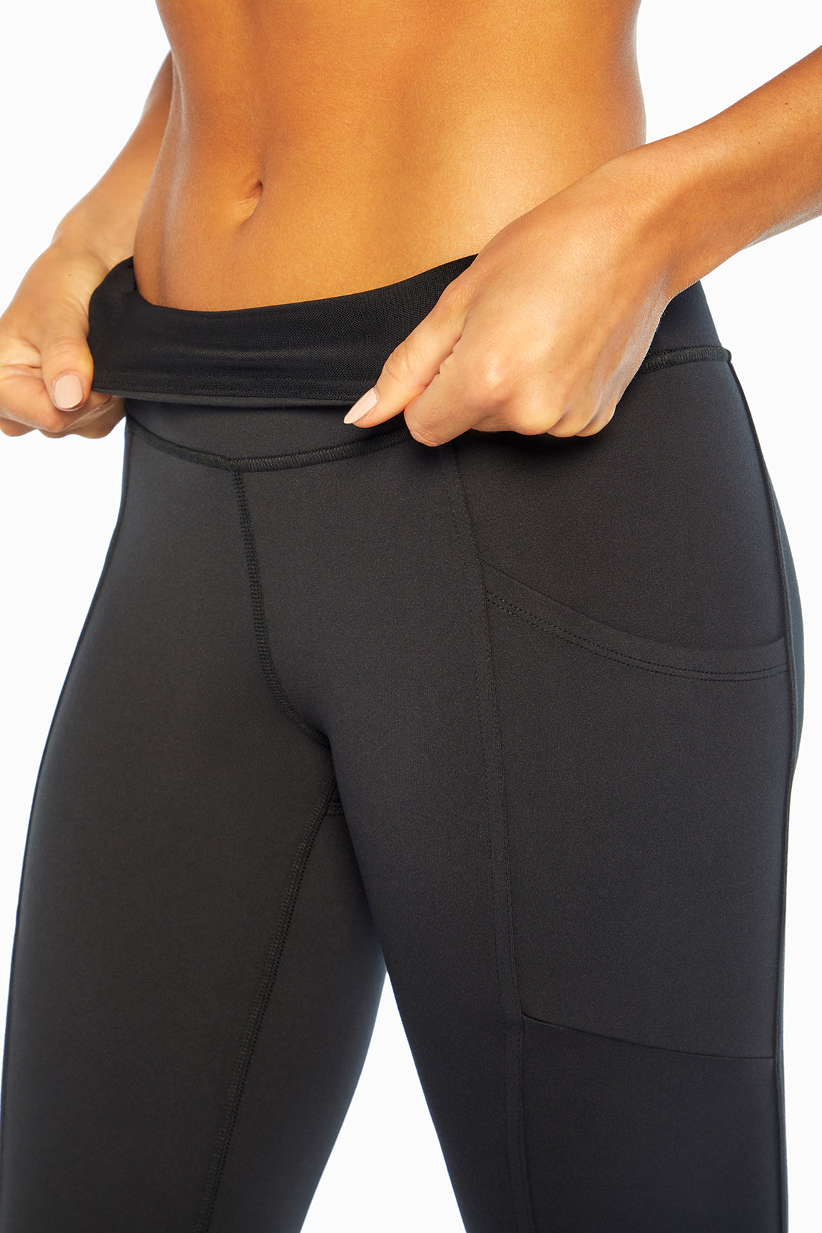 Eclipse Side Pocket Tummy Control Ankle Legging, side view showing pocket placement, showing visible design features and texture of the stretch knit..