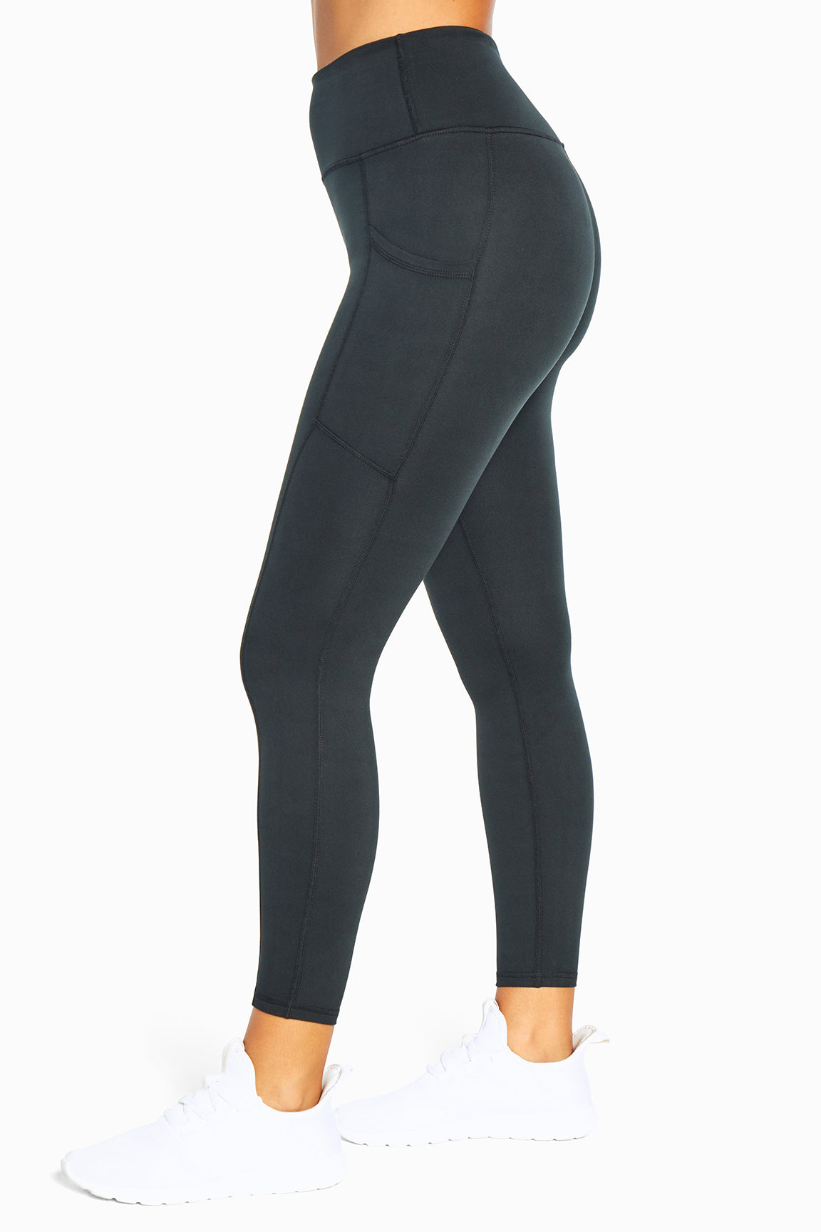 Balance Collection Easy Eclipse Side Pocket Ankle Legging - Black, alternate angle view, showing visible design features and texture of the stretch..