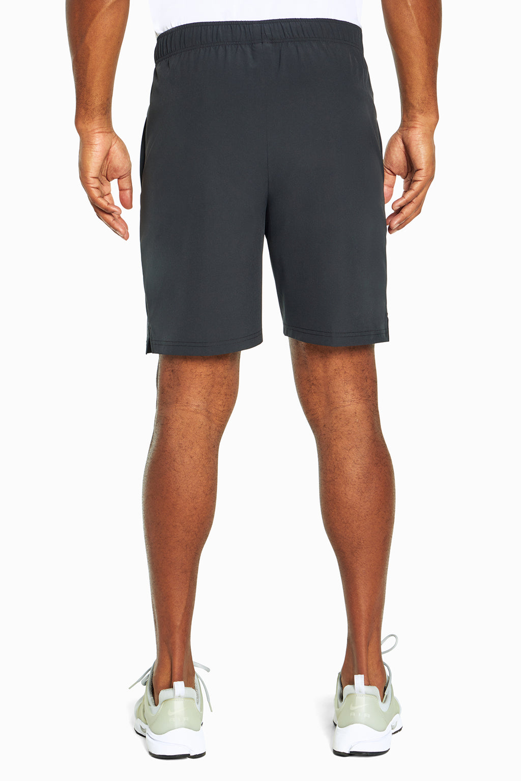 Balance Collection For Men Base Short, side view showing pocket placement, showing visible design features and texture of the soft knit fabric.. #color_black