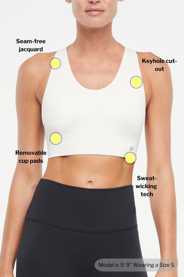 Addie Seamless Sports Bra, back view, showing visible design features and texture of the soft knit fabric.. 