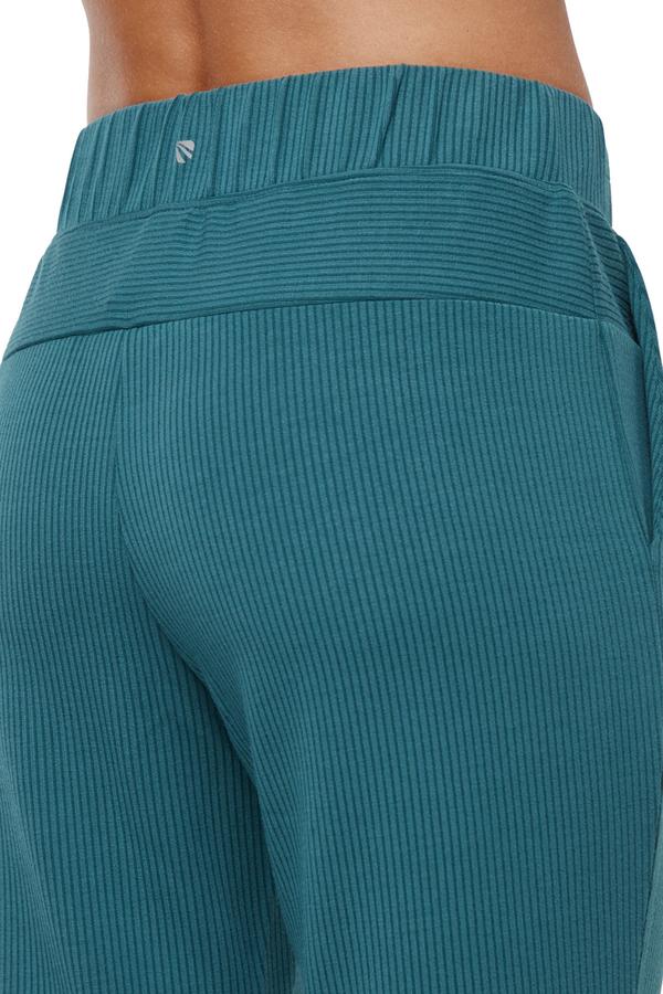 Paige Bootcut Pant, side view showing pocket placement, showing visible design features and texture of the durable stretch fabric.. 