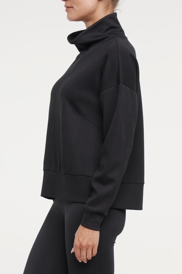 Sage Knit Pullover, alternate angle view, showing visible design features and texture of the soft knit fabric.. 