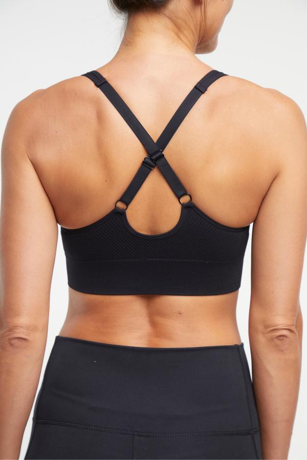 Addie Seamless Sports Bra, alternate angle view, showing visible design features and texture of the soft knit fabric.. 