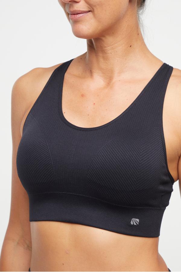 Addie Seamless Sports Bra, alternate angle view, showing visible design features and texture of the soft knit fabric.. 