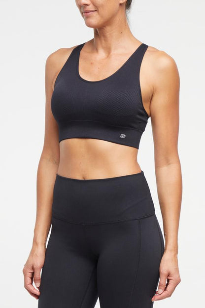 Addie Seamless Sports Bra, alternate angle view, showing visible design features and texture of the soft knit fabric.. 