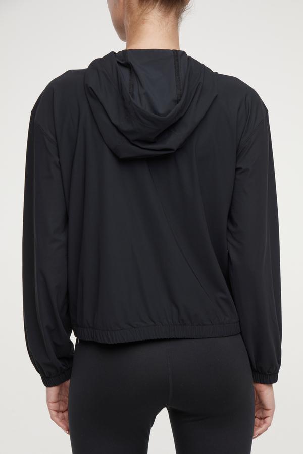 Nori Jacket, alternate angle view, showing visible design features and texture of the smooth woven fabric.. 