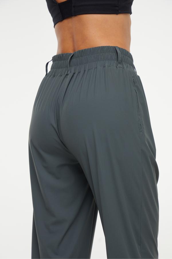 Nori Tapered Pant, side view showing pocket placement, showing visible design features and texture of the durable stretch fabric.. 