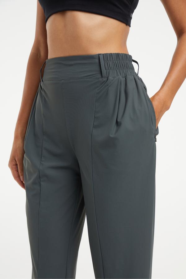 Nori Tapered Pant, close-up view of fabric and stitching, showing visible design features and texture of the durable stretch fabric.. 