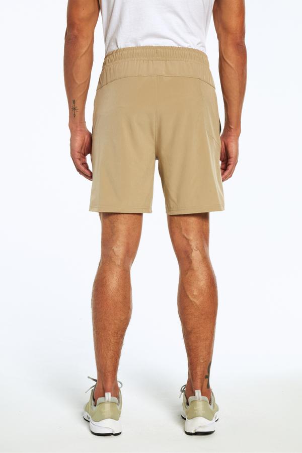 Balance Collection For Men Carson Short, side view showing pocket placement, showing visible design features and texture of the soft knit fabric.. 