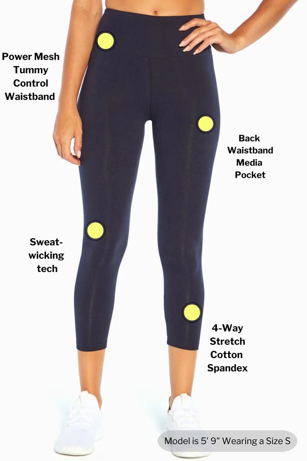 Carrie Tummy Control Mid Calf Capri, close-up view of fabric and stitching, showing visible design features and texture of the soft knit fabric.. #color_midnight-blue