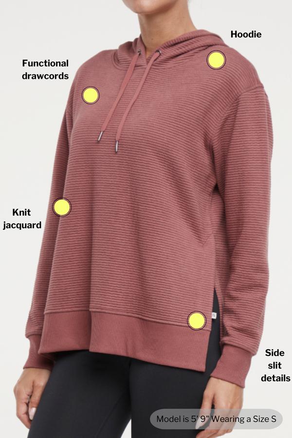Cora Pullover Hoodie, close-up view of fabric and stitching, showing visible design features and texture of the soft fleece fabric.. 
