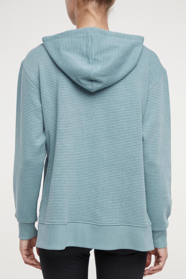 Cora Pullover Hoodie, alternate angle view, showing visible design features and texture of the soft fleece fabric.. 
