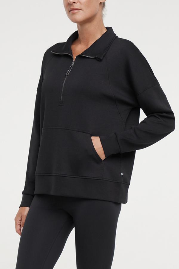 Sage 1/2 Zip, alternate angle view, showing visible design features and texture of the soft knit fabric.. #color_black