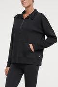 Sage 1/2 Zip, alternate angle view, showing visible design features and texture of the soft knit fabric.. #color_black