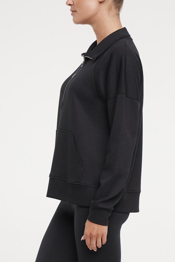 Sage 1/2 Zip, alternate angle view, showing visible design features and texture of the soft knit fabric.. #color_black