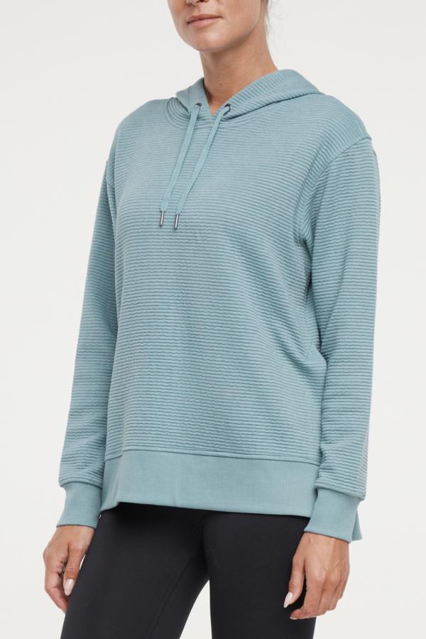 Cora Pullover Hoodie, alternate angle view, showing visible design features and texture of the soft fleece fabric.. 
