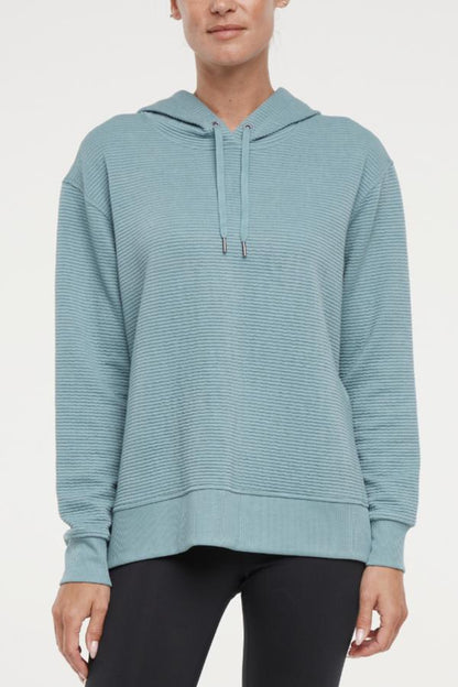 Cora Pullover Hoodie, alternate angle view, showing visible design features and texture of the soft fleece fabric.. 