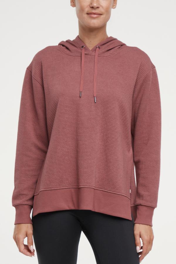 Cora Pullover Hoodie, alternate angle view, showing visible design features and texture of the soft fleece fabric.. 