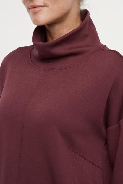 Sage Knit Pullover, back view, showing visible design features and texture of the soft knit fabric.. 