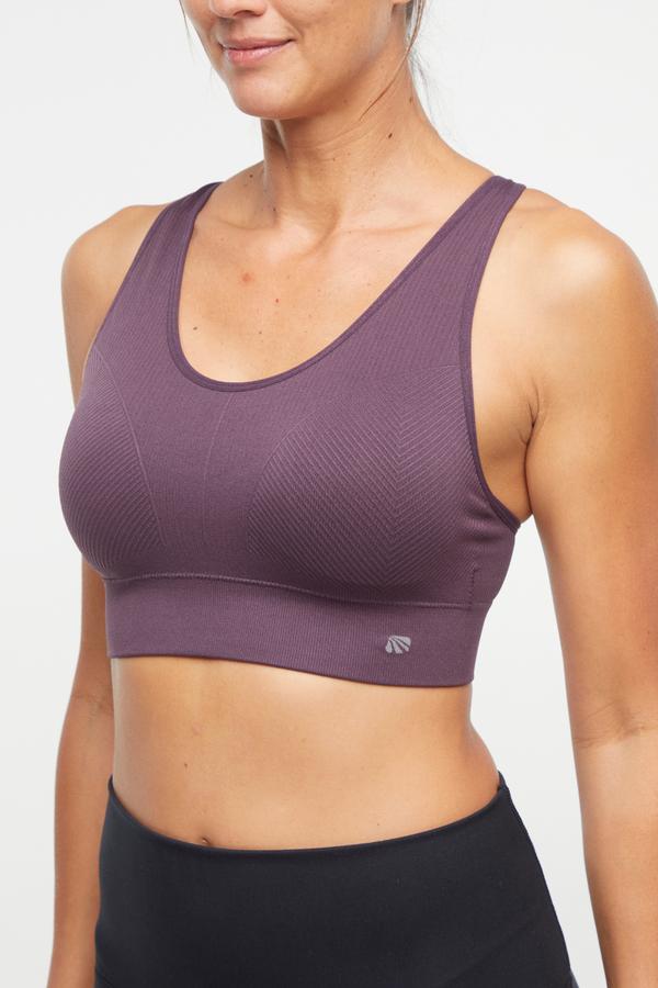 Addie Seamless Sports Bra, alternate angle view, showing visible design features and texture of the soft knit fabric.. 