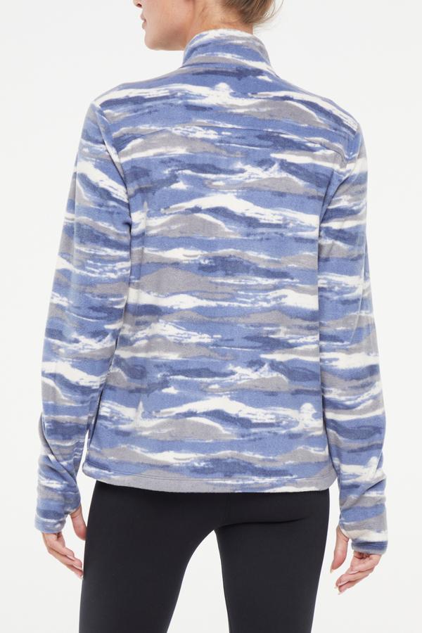 Treeline Fleece Jacket - Vintage Indigo, side view showing pocket placement, showing visible design features and texture of the smooth woven fabric.. #color_vintage-indigo-mountain-ridges