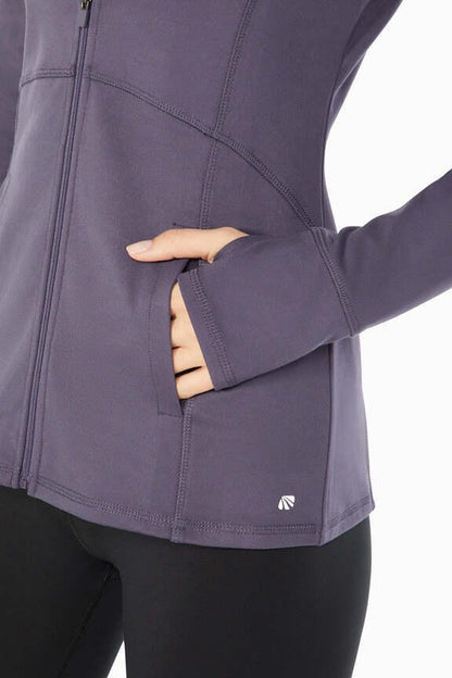 Revival Jacket, alternate angle view, showing visible design features and texture of the smooth woven fabric.. 