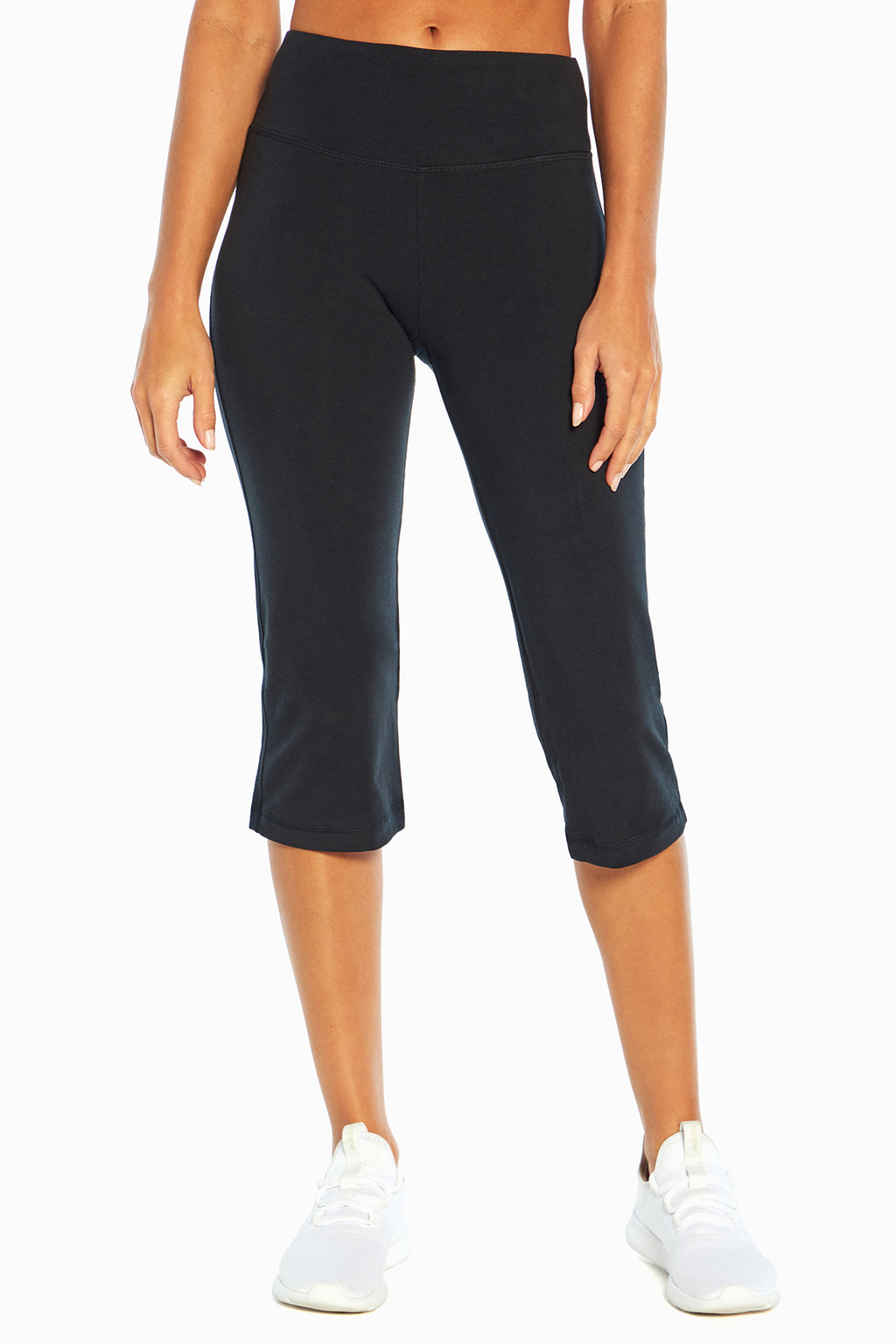 Zoey Tummy Control Capris, front view showing pocket placement, showing visible design features and texture of the soft knit fabric. #color_black