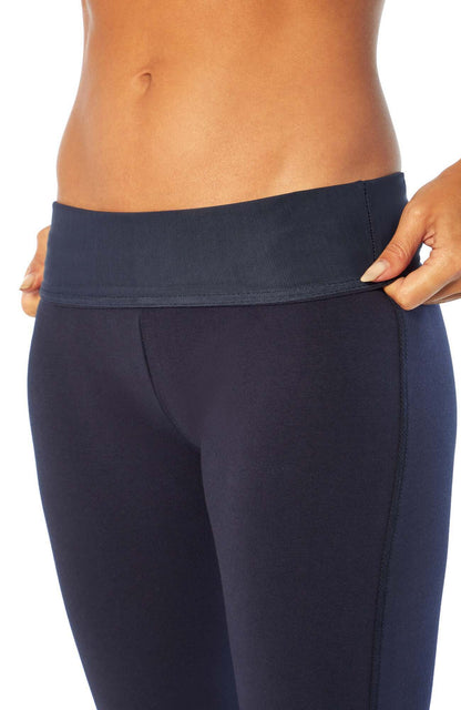 Becca Tummy Control Bermuda Shorts, side view showing pocket placement, showing visible design features and texture of the soft knit fabric.. 