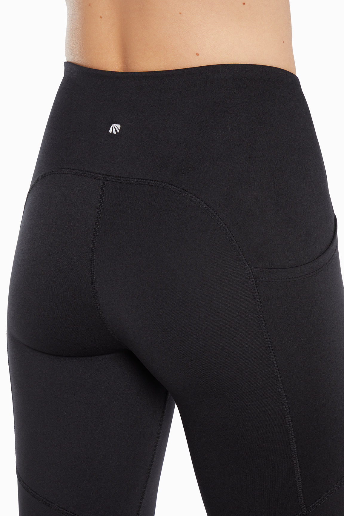 Della Pant - Black, side view showing pocket placement, showing visible design features and texture of the durable stretch fabric.. 