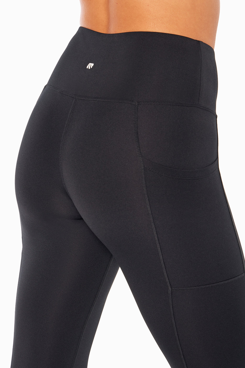 High Rise Side Pocket Ankle Legging - Black, side view showing pocket placement, showing visible design features and texture of the stretch knit.. #color_black