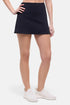 Front view of woman wearing a black skort on a white background. 