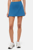 Front view of woman wearing a blue skort on a white background. 
