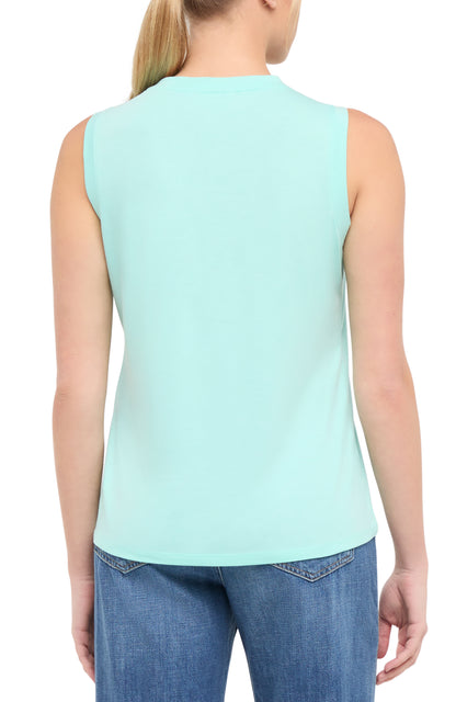 Back view of woman wearing a light teal blue sleeveless shirt on a white background. 
