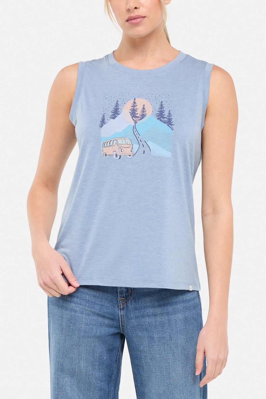 Front view of woman wearing a sleeveless light blue shirt with a graphic design of a van and mountains on white background. #color_heather-troposphere-road-trip-van