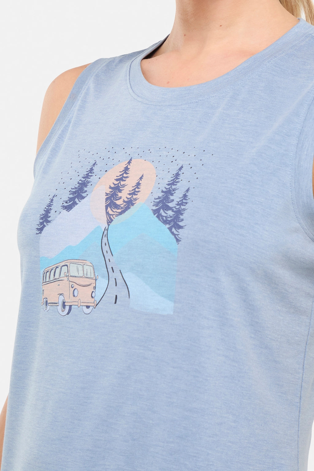 Close up front view of woman wearing a sleeveless light blue shirt with a graphic design of a van and mountains on white background. #color_heather-troposphere-road-trip-van