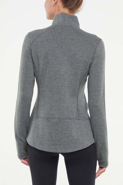 Journey Full Zip Jacket, side view showing pocket placement, showing visible design features and texture of the smooth woven fabric.. 