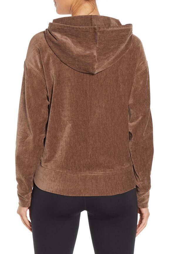 Ruth Hoodie, side view showing pocket placement, showing visible design features and texture of the soft fleece fabric.. 
