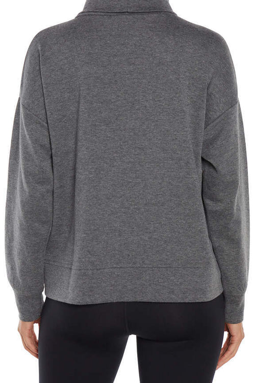 Alana Pullover, side view showing pocket placement, showing visible design features and texture of the soft knit fabric.. #color_heather-black