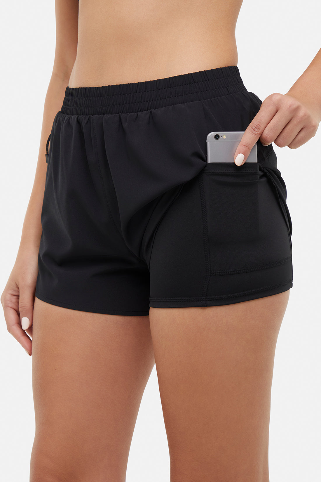 Victoria Short - Black, side view showing pocket placement, showing visible design features and texture of the soft knit fabric.