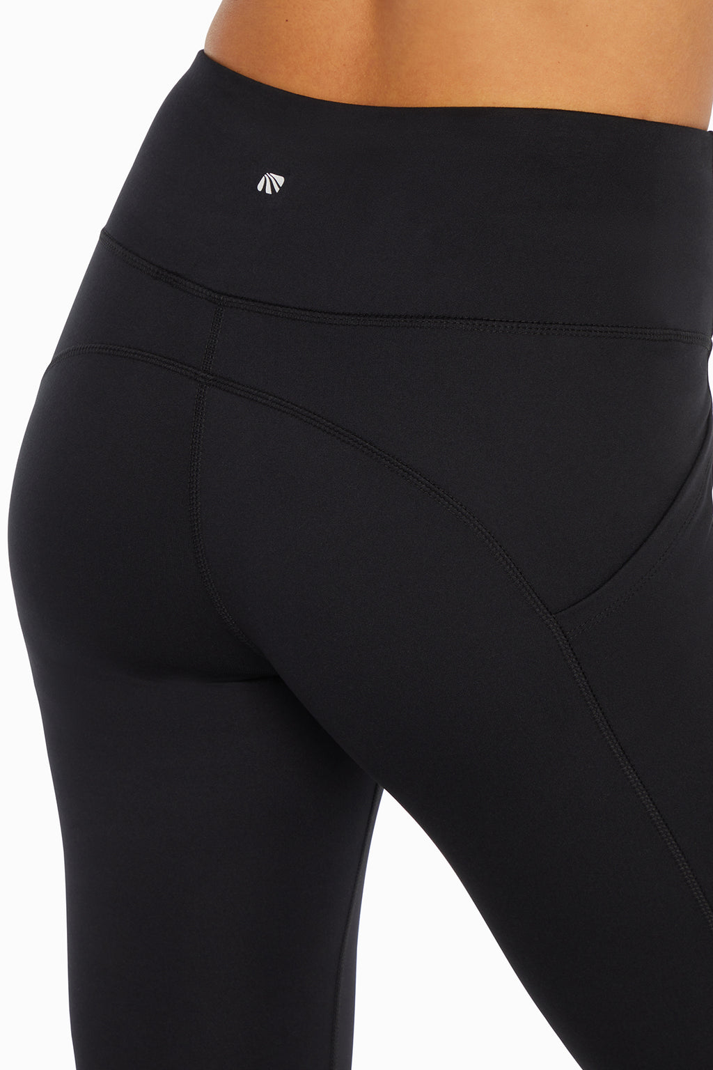 Kira Side Pocket Ankle Legging - Black, side view showing pocket placement, showing visible design features and texture of the stretch knit fabric.. #color_black