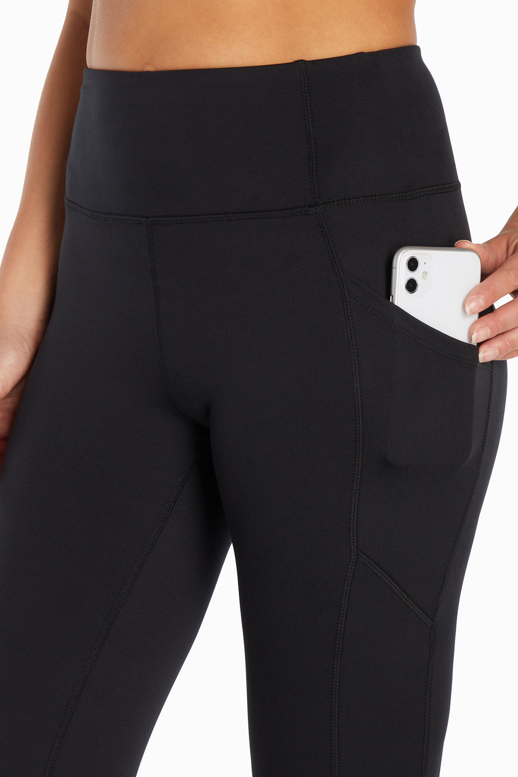 Kira Side Pocket Ankle Legging - Black, close-up view of fabric and stitching, showing visible design features and texture of the stretch knit fabric.. #color_black