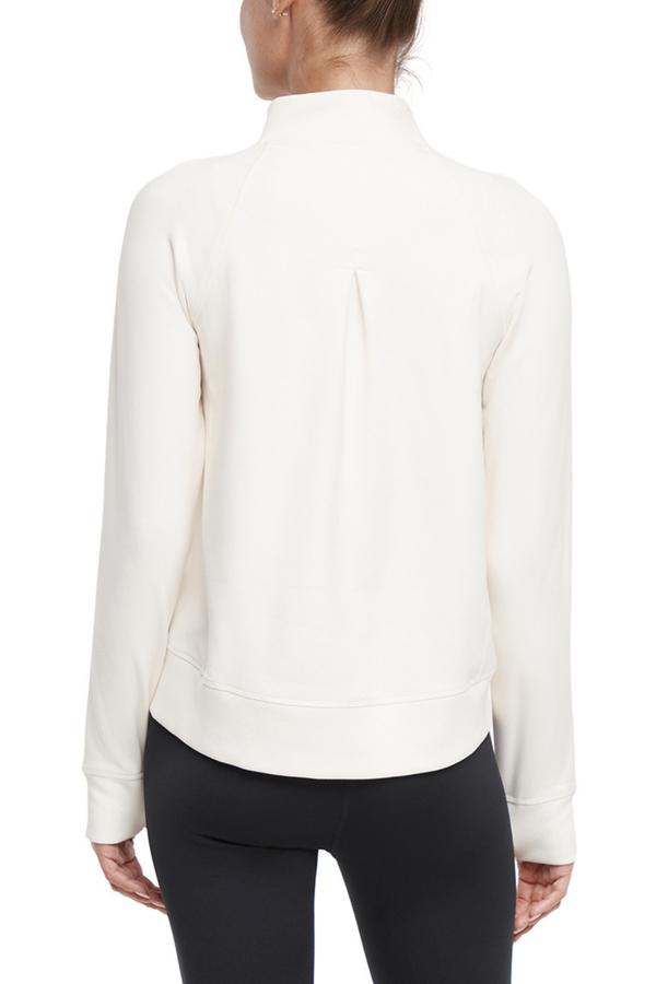 Mia 1/4 Zip Pullover, side view showing pocket placement, showing visible design features and texture of the soft knit fabric.. 